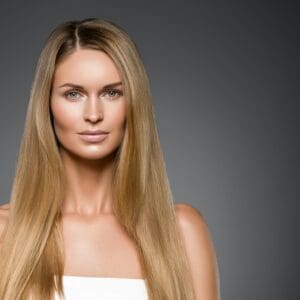 Beauty woman face healthy beautiful skin and blond smooth hair