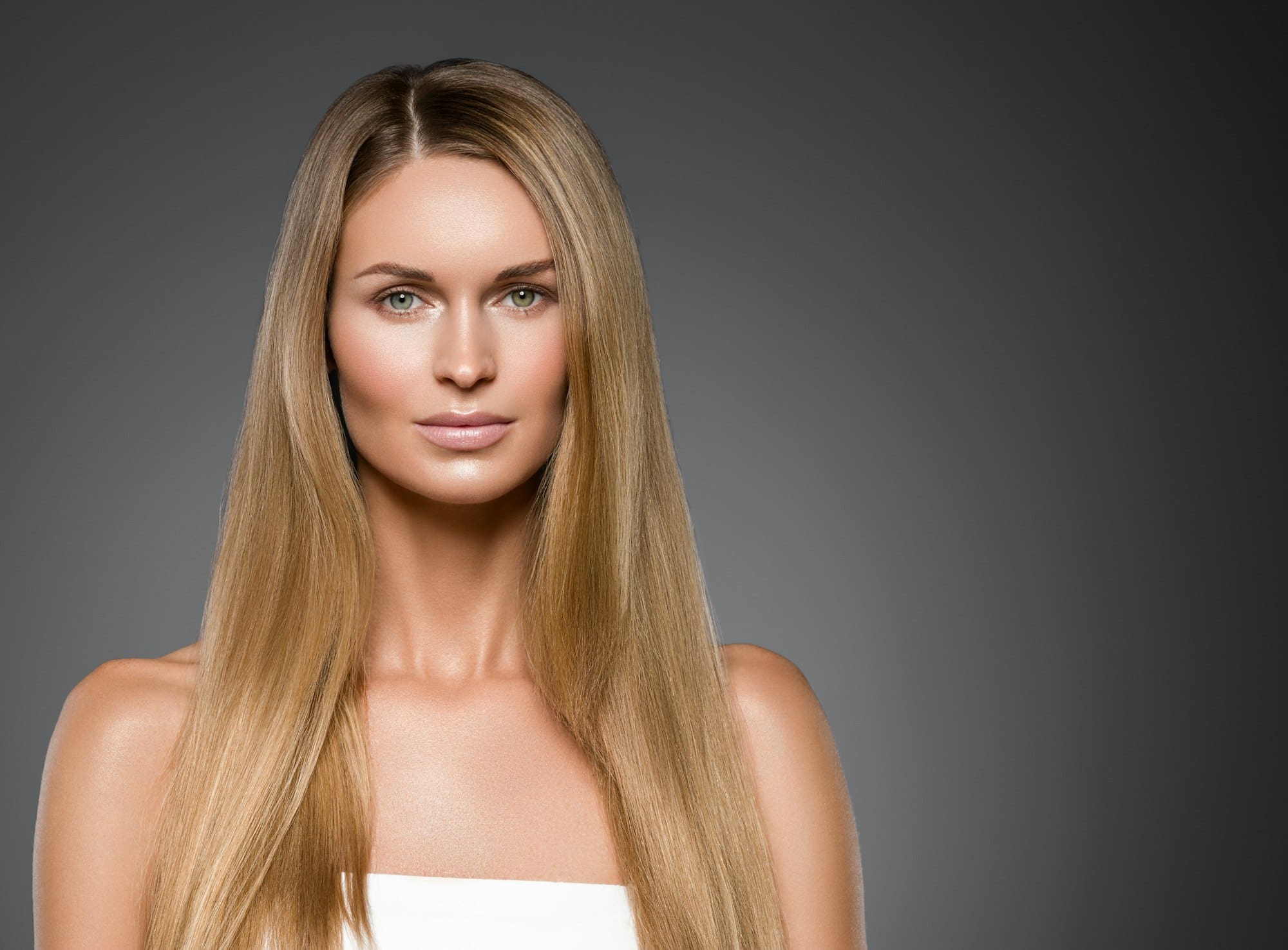 Beauty woman face healthy beautiful skin and blond smooth hair