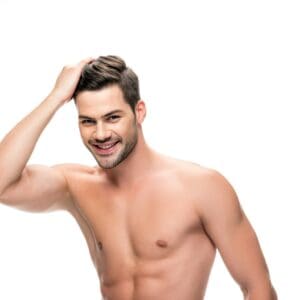 handsome shirtless man touching his hair isolated on white