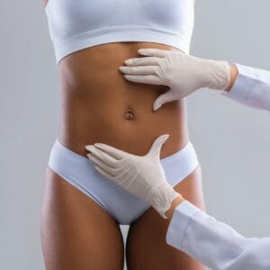 Plastic surgeon consulting woman before beauty procedure
