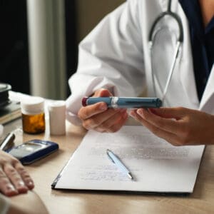 Doctor Explaining How to Use an Insulin Pen