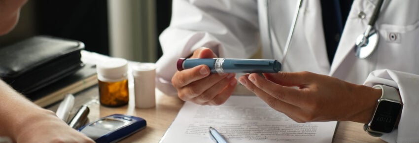 Doctor Explaining How to Use an Insulin Pen